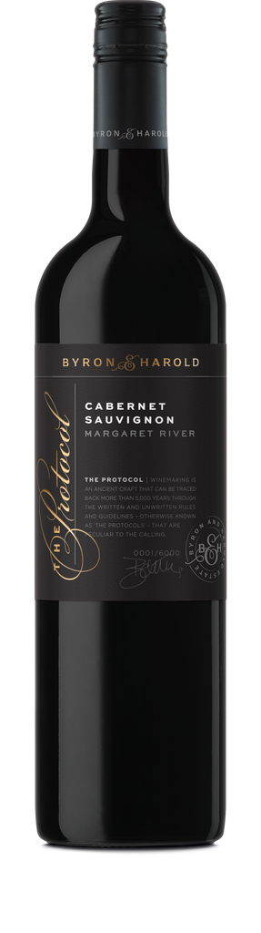 A Cabernet Sauvignon bottle from Margaret River with a black cap and black label with beautiful cursive writing of The Protocol in gold for Byron & Harold wines.