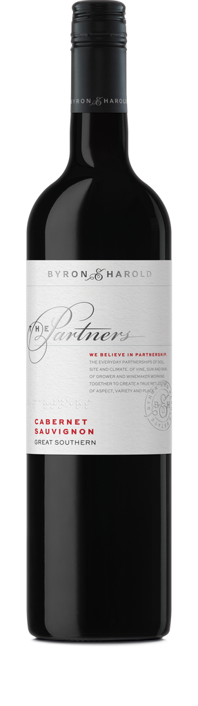 A Cabernet Sauvignon bottle from Great Southern with a black cap and white label with beautiful cursive writing of The Partners in black for Byron & Harold wines.