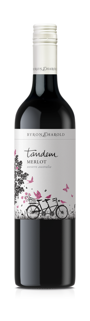 A Merlot bottle from Western Australia with a white cap and a white label with an illustration of a Tandem bike with purple birds and butterflies for Byron & Harold wines.